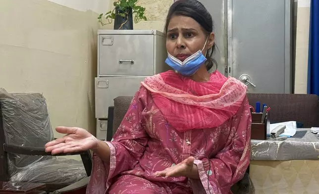 Nurse Razia Noreen, who risked her life to save a newborn during a fire at the Pakistan Institute of Medical Sciences, speaks during an interview in Islamabad, Tuesday, Sept. 1, 2026. (AP Photo/M.Yousaf)
