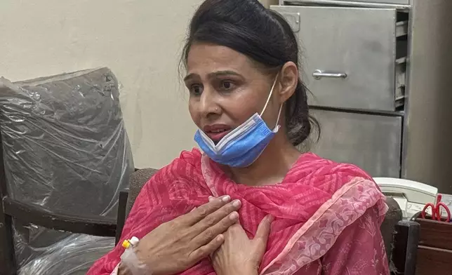 Nurse Razia Noreen, who risked her life to save a newborn during a fire at the Pakistan Institute of Medical Sciences, speaks during an interview in Islamabad, Tuesday, Sept. 1, 2026. (AP Photo/M.Yousaf)