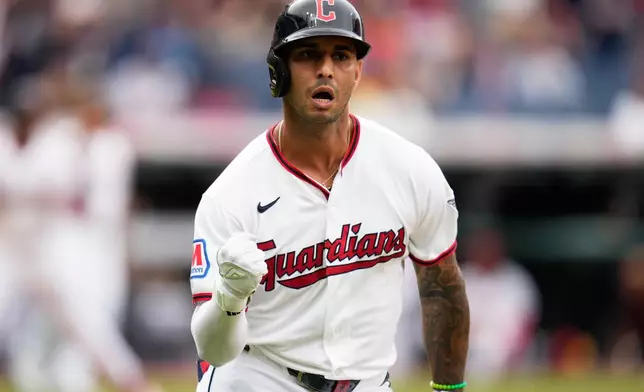 Cleveland Guardians' Brayan Rocchio gestures as he runs the bases after hitting a grand slam home run in the fourth inning of the first baseball game of a split doubleheader against the Detroit Tigers in Cleveland, Friday, Sept. 4, 2026. (AP Photo/Sue Ogrocki)
