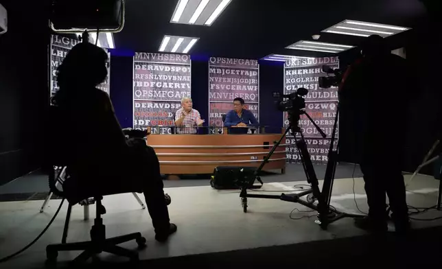 Jorge Luis González, former director of the independent newspaper Tribuna, left, and journalist Lorenzo Chim Caamal, host the program Expediente in Campeche, Mexico, Thursday, Sept. 17, 2026. (AP Photo/Martin Zetina)