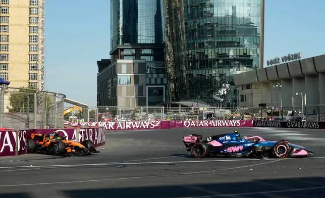 McLaren driver Lando Norris of Britain and Alpine driver Franco Colapinto of Argentina sit in their cars after crashing during the Azerbaijan F1 Grand Prix race, in Baku, Azerbaijan, Saturday, Sept. 26, 2026. (AP Photo/Darko Bandic)