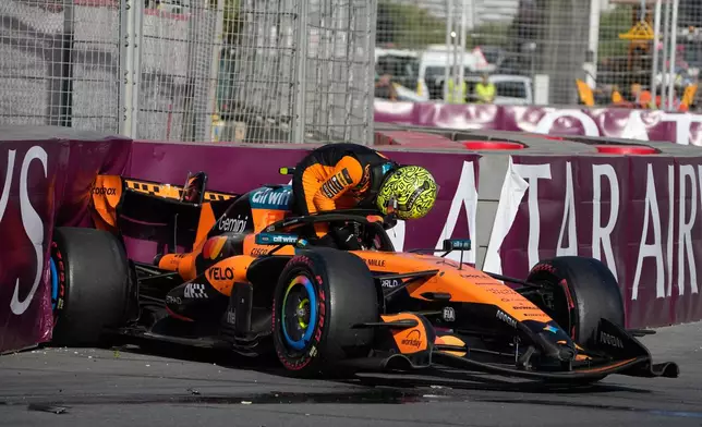 McLaren driver Lando Norris of Britain gets out of his car after a crash during the Azerbaijan F1 Grand Prix auto race, in Baku, Azerbaijan, Saturday, Sept. 26, 2026. (AP Photo/Darko Bandic)