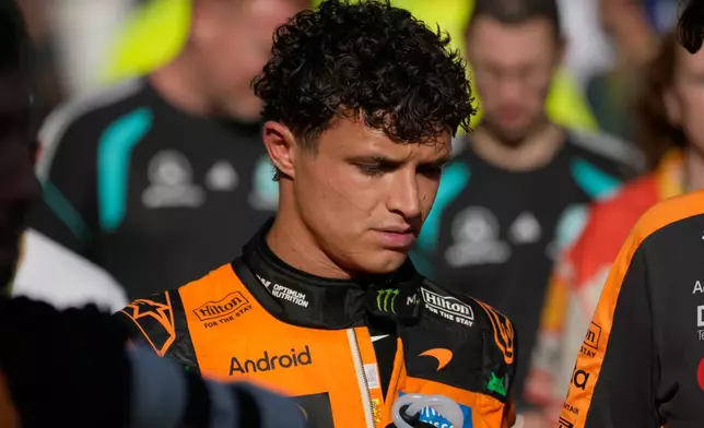 McLaren driver Lando Norris of Britain walks down pit lane following his crash during the Azerbaijan F1 Grand Prix auto race, in Baku, Azerbaijan, Saturday, Sept. 26, 2026. (AP Photo/Pavel Bednyakov)