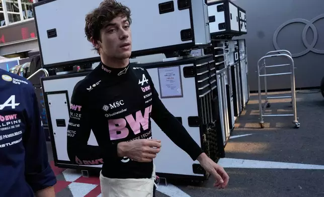 Alpine driver Franco Colapinto of Argentina walks down pit lane following his crash during the Azerbaijan F1 Grand Prix auto race, in Baku, Azerbaijan, Saturday, Sept. 26, 2026. (AP Photo/Darko Bandic) CORRECTION: Photographer Darko Bandic instead of Pavel Bednyakov