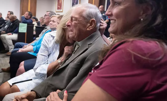 Surrounded by friends and family, Tim Miller, father of Laura Miller, reacts after James Dolphs Elmore Jr. was found guilty of manslaughter in the death of Laura Miller, Wednesday, Sept. 2, 2026, in Galveston, Texas. (Stuart Villanueva/The Galveston County Daily News via AP, Pool)