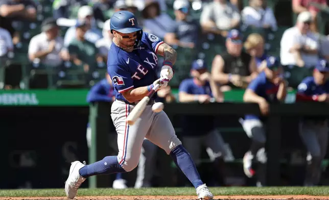 Texas Rangers Cody Freeman gets a hit off Seattle Mariners starting pitcher Kade Anderson during the fifth inning of a baseball game, Wednesday, Sept. 9, 2026, in Seattle. (AP Photo/Jason Redmond)