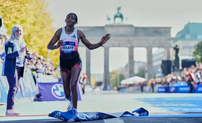 Ethiopia's Tigist Assefa crosses the finish line to win the Berlin Marathon in Berlin, Germany, Sunday, Sept. 27, 2026. (AP Photo/Ebrahim Noroozi)