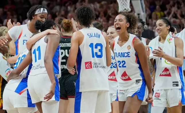 French players celebrate after the Women's Basketball World Cup semifinal match between France and Germany in Berlin, Saturday, Sept. 12, 2026. (AP Photo/Ebrahim Noroozi)