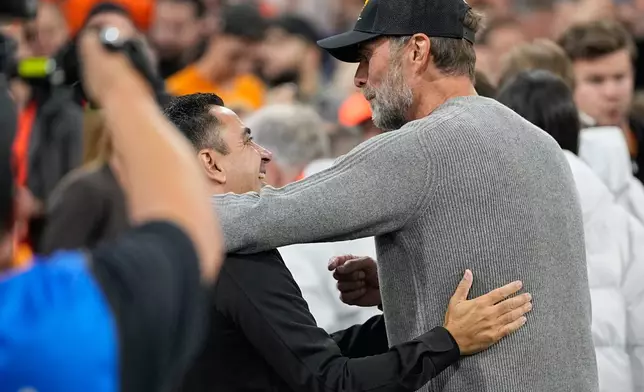 Netherlands coach Xavi Hernandez, left, and Germany's coach Jurgen Klopp hug before the UEFA Nations League soccer match between the Netherlands and Germany in Amsterdam, Netherlands, Thursday, Sept. 24, 2026. (AP Photo/Martin Meissner)