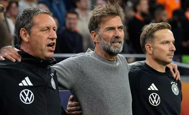 Germany's coach Jurgen Klopp sings the national anthem before the UEFA Nations League soccer match between the Netherlands and Germany in Amsterdam, Netherlands, Thursday, Sept. 24, 2026. (AP Photo/Martin Meissner)