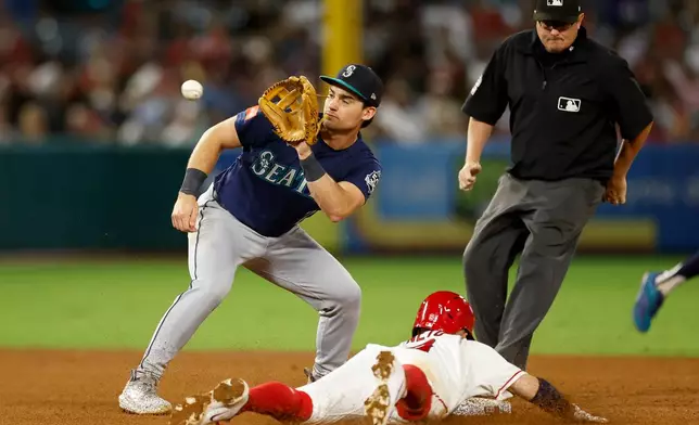 Seattle Mariners second baseman Cole Young (2) readies to catch the ball as Los Angeles Angels' Zach Neto (9) slides into second base during the fourth inning of a baseball game Wednesday, Sept. 16, 2026, in Anaheim, Calif. (AP Photo/Caroline Brehman)