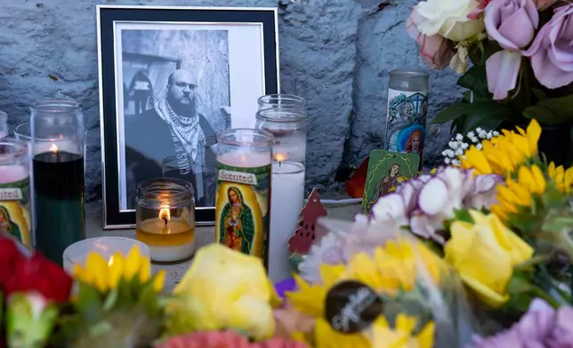 A growing memorial sits outside the Venture-N Bar in Tucson, Ariz., Tuesday, Sept. 1, 2026, for Cameron Capara, pictured, and Vincent Siquieros, who were fatally shot in the parking lot of the gay bar shortly after midnight Monday. (AP Photo/Rebecca Noble)