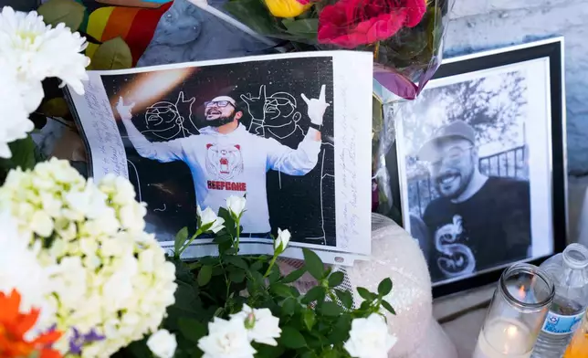 A growing memorial sits outside the Venture-N Bar in Tucson, Ariz., Tuesday, Sept. 1, 2026, for Vincent Siquieros, pictured, and Cameron Capara, who were fatally shot in the parking lot of the gay bar shortly after midnight Monday. (AP Photo/Rebecca Noble)