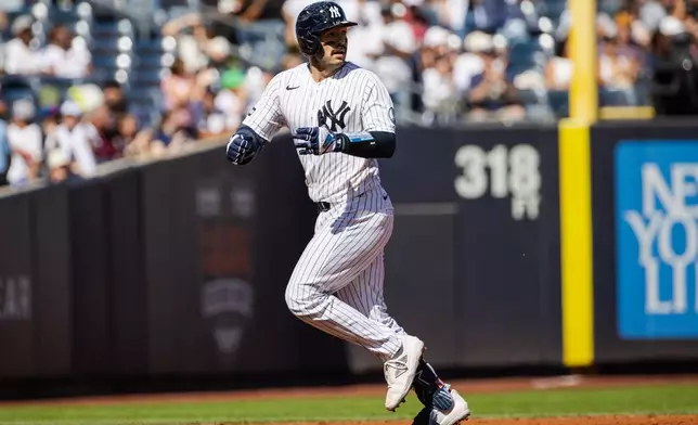New York Yankees' Austin Wells runs the bases after hitting a home run during the third inning of a baseball game against the New York Mets, Sunday, Sept. 13, 2026, in New York. (AP Photo/Angelina Katsanis)