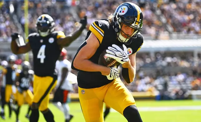 Pittsburgh Steelers wide receiver Ben Skowronek (15) catches a pass for a touchdown during the first half of an NFL football game against the Cincinnati Bengals in Pittsburgh, Sunday, Sept. 27, 2026. (AP Photo/Justin Berl)