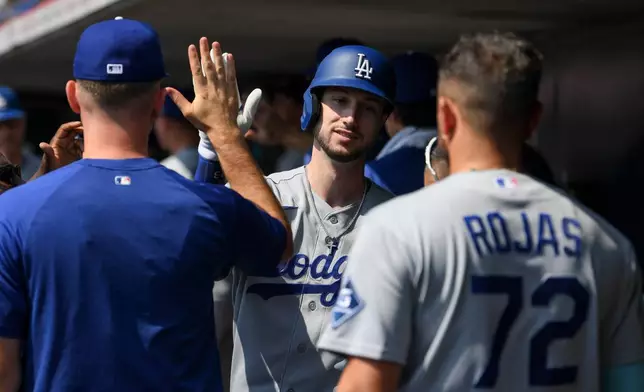 Los Angeles Dodgers' Kyle Tucker celebrates in the dugout after hitting a two-run home run during the first inning of a baseball game against the Cincinnati Reds, Thursday, Sept. 17, 2026 in Cincinnati. (AP Photo/Tanner Pearson)
