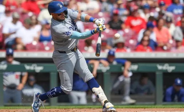 Los Angeles Dodgers' Miguel Rojas singles during the second inning of a baseball game against the Cincinnati Reds, Thursday, Sept. 17, 2026 in Cincinnati. (AP Photo/Tanner Pearson)