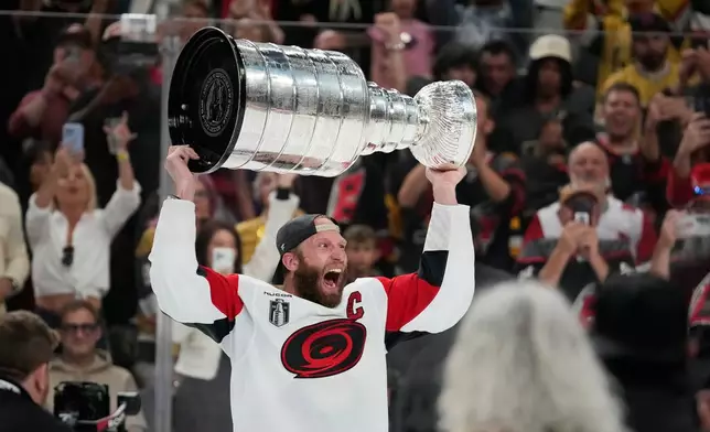 FILE - Carolina Hurricanes center Jordan Staal celebrates after a win over the Vegas Golden Knights in Game 6 of the NHL hockey Stanley Cup Final series June 14, 2026, in Las Vegas. (AP Photo/John Locher, File)