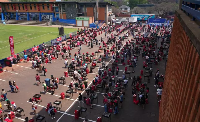 Participants attempt to break a world record for the most people cooking simultaneously at a barbecue at Loftus Versfeld Stadium, Pretoria, South Africa, Thursday, Sept. 24, 2026. (AP Photo/Alfonso Nqunjana)