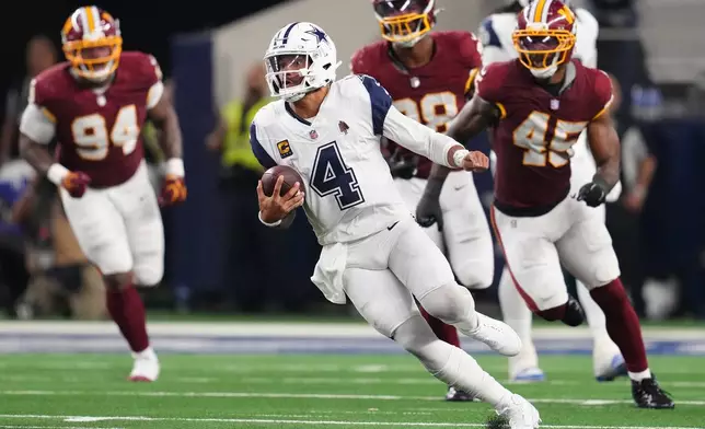 Dallas Cowboys quarterback Dak Prescott (4) runs against the Washington Commanders in the second half during an NFL football game in Arlington, Texas, Sunday, Sept. 20, 2026. (AP Photo/Tony Gutierrez)