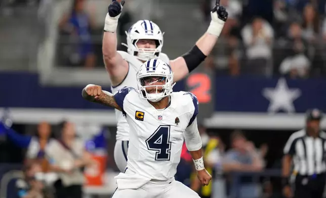 Dallas Cowboys quarterback Dak Prescott (4) celebrates after throwing a pass for a touchdown against the Washington Commanders in the second half during an NFL football game in Arlington, Texas, Sunday, Sept. 20, 2026. (AP Photo/Tony Gutierrez)