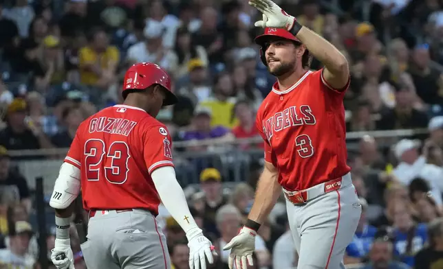 Los Angeles Angels' Josh Lowe (3) celebrates with Denzer Guzman (23) on the way back to the dugout after his home run off Pittsburgh Pirates pitcher Braxton Ashcraft during the fifth inning of a baseball game in Pittsburgh, Saturday, Sept. 5, 2026. (AP Photo/Tom E. Puskar) CORRECTION: Corrects to fifth inning not fourth inning.