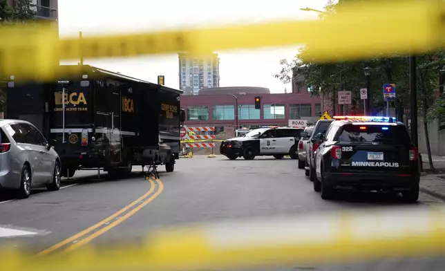 Police continue to investigate the scene of a Wednesday shooting at Shoreline Plaza apartments, Thursday, Sept. 3, 2026, in Minneapolis. (AP Photo/Ellen Schmidt) CORRECTION: Shoreline, not Shoreview