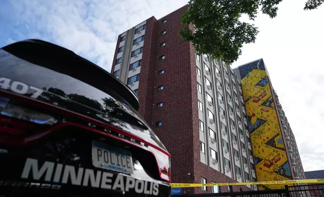 Police continue to investigate the scene of a Wednesday shooting at Shoreline Plaza apartments, Thursday, Sept. 3, 2026, in Minneapolis. (AP Photo/Ellen Schmidt) CORRECTION: Shoreline, not Shoreview