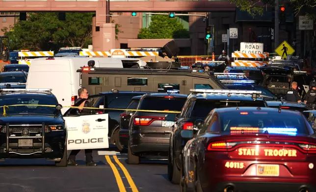 Law enforcement respond to a shooting Wednesday, Sept. 2, 2026, in downtown Minneapolis. (AP Photo/Ellen Schmidt)