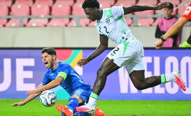 Oscar Gloukh of Israel, left, in action against James Abankwah of Ireland during the UEFA Nations League soccer match between Ireland and Israel in Debrecen, Hungary, Sunday, Sept. 27, 2026. (Zsolt Czegledi/MTI via AP)