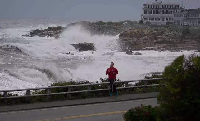Surf breaks on the rocky coastline during the early stages of a nor'easter storm, Friday, Sept. 25, 2026, in Gloucester, Mass. (AP Photo/Robert F. Bukaty)