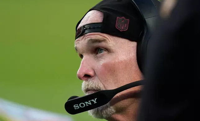Washington Commanders head coach Dan Quinn watches from the sidelines during the second half of an NFL football game against the Philadelphia Eagles, Sunday, Sept. 13, 2026, in Philadelphia. (AP Photo/Chris Szagola)