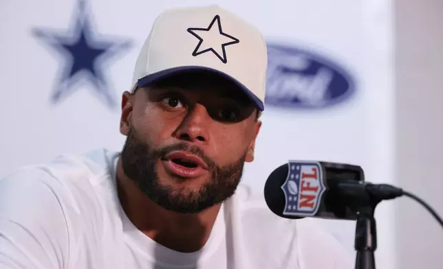 Dallas Cowboys quarterback Dak Prescott talks to reporters following an NFL football game against the New York Giants, Monday, Sept. 14, 2026, in East Rutherford, N.J. (AP Photo/Pamela Smith)