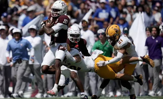 Texas A&M quarterback Marcel Reed (10) is tackeld by Arizona State linebacker Owen Long (22) after a 18 yard scramble during the second quarter of an NCAA college football game Saturday, Sept. 12, 2026, in College Station, Texas. (AP Photo/Sam Craft)