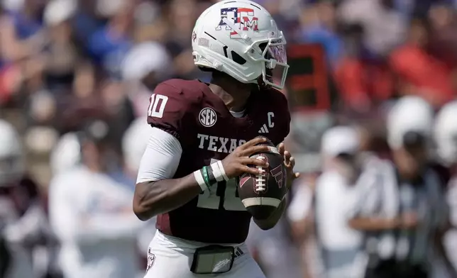 Texas A&M quarterback Marcel Reed (10) looks to pass downfield against Arizona State during the first quarter of an NCAA college football game Saturday, Sept. 12, 2026, in College Station, Texas. (AP Photo/Sam Craft)