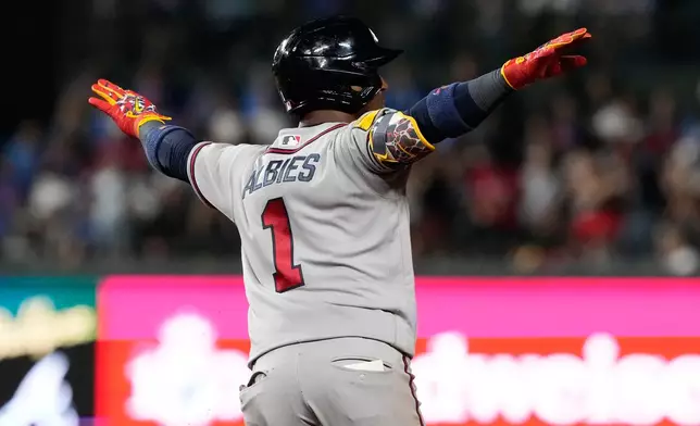 Atlanta Braves' Ozzie Albies celebrates as he rounds the bases after hitting a two-run home run during the seventh inning of a baseball game against the Chicago Cubs in Chicago, Tuesday, Sept. 15, 2026. (AP Photo/Nam Y. Huh)