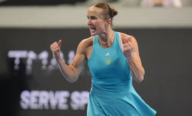 Elina Svitolina of Ukraine celebrates winning her match against Jasmine Paolini of Italy in the Billie Jean King Cup women's singles semifinal between Ukraine and Italy, in Shenzhen, China, Saturday, Sept. 26, 2026. (AP Photo/Andy Wong)