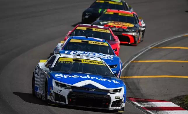 Carson Hocevar, front, drives during a NASCAR Cup Series auto race Sunday, Sept. 13, 2026, in Madison, Ill. (AP Photo/Connor Hamilton)