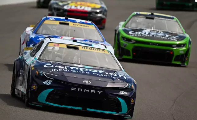 Tyler Reddick, front, drives during a NASCAR Cup Series auto race Sunday, Sept. 13, 2026, in Madison, Ill. (AP Photo/Connor Hamilton)