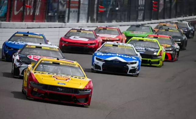 Joey Logano leads during a NASCAR Cup Series auto race Sunday, Sept. 13, 2026, in Madison, Ill. (AP Photo/Connor Hamilton)
