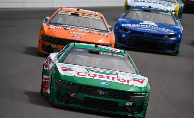 Brad Keselowski, front, drives during a NASCAR Cup Series auto race Sunday, Sept. 13, 2026, in Madison, Ill. (AP Photo/Connor Hamilton)
