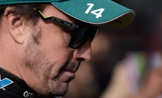 Aston Martin driver Fernando Alonso of Spain walks through the paddock prior to the qualifying session for the Azerbaijan F1 Grand Prix, in Baku, Azerbaijan, Friday, Sept. 25, 2026. (AP Photo/Pavel Bednyakov)