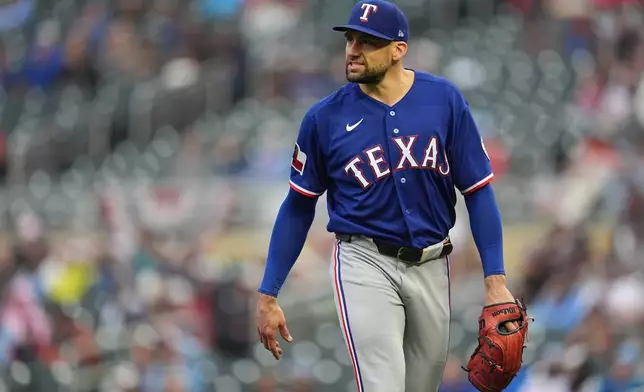Texas Rangers starting pitcher Nathan Eovaldi reacts after completing the bottom of the second inning of a baseball game against the Minnesota Twins Saturday, Sept. 26, 2026, in Minneapolis. (AP Photo/Abbie Parr)