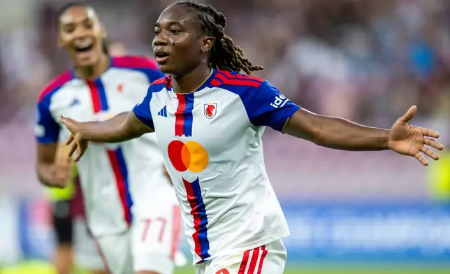 OL Lyonnes' Melchie Dumornay celebrates during a UEFA Women's Champions League soccer match against Servette FC Chenois in Geneva, Switzerland, Wednesday, Sept. 23, 2026. (Martial Trezzini/Keystone via AP)