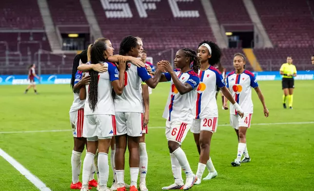 OL Lyonnes's players celebrate the goal against Servette FC Chenois during a UEFA Women's Champions League soccer match in Geneva, Switzerland, Wednesday, Sept. 23, 2026. (Martial Trezzini/Keystone via AP)