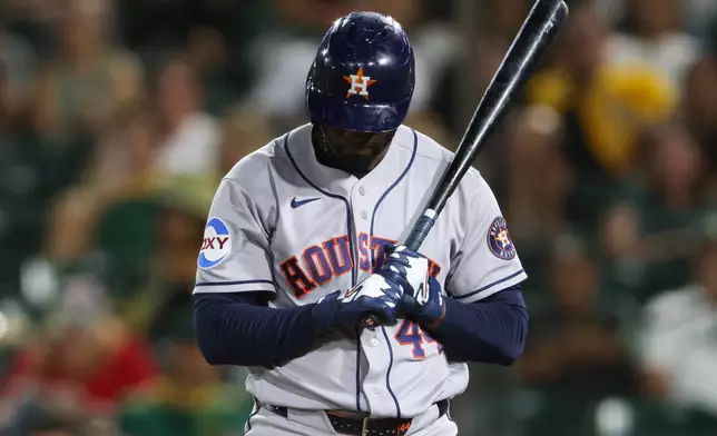 Houston Astros' Yordan Alvarez looks down after being called out on strikes during the fifth inning of a baseball game against the Athletics Thursday, Sept. 24, 2026, in West Sacramento, Calif. (AP Photo/Scott Marshall)