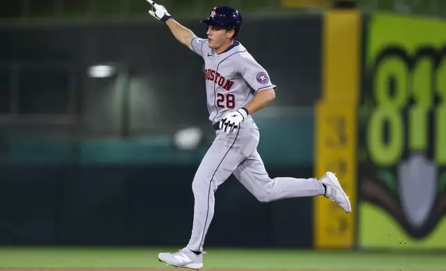 Houston Astros' Lucas Spence jogs around the bases after hitting a solo home run during the seventh inning of a baseball game against the Athletics Thursday, Sept. 24, 2026, in West Sacramento, Calif. (AP Photo/Scott Marshall)