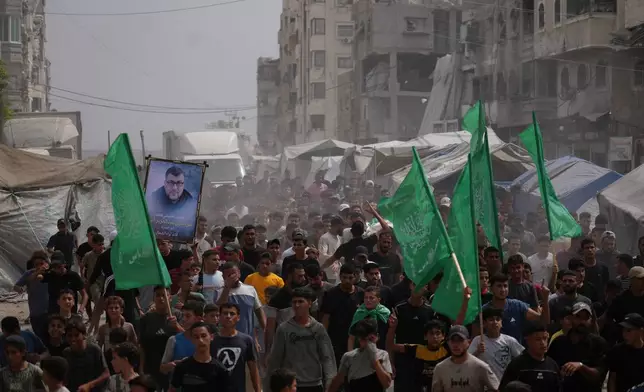 Palestinians carry the bodies of Hamas militants Mohannad Abu Foul and Izz Al Din Al Beik, during their funeral after they were killed in an Israeli airstrike, in Gaza City, Tuesday, Sept. 29, 2026. (AP Photo/Jehad Alshrafi)