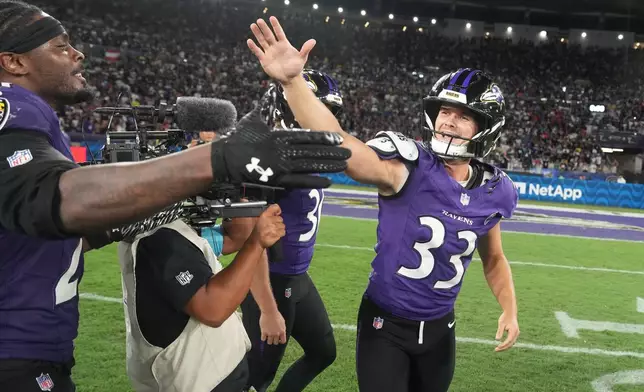 Baltimore Ravens place kicker Tyler Loop (33) celebrates after winning an NFL football game against the Dallas Cowboys in Rio de Janeiro, Sunday, Sept. 27, 2026. (AP Photo/Fernando Llano)