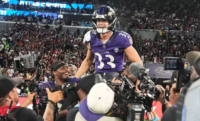 Baltimore Ravens place kicker Tyler Loop (33) celebrates after winning an NFL football game against the Dallas Cowboys in Rio de Janeiro, Sunday, Sept. 27, 2026. (AP Photo/Fernando Llano)